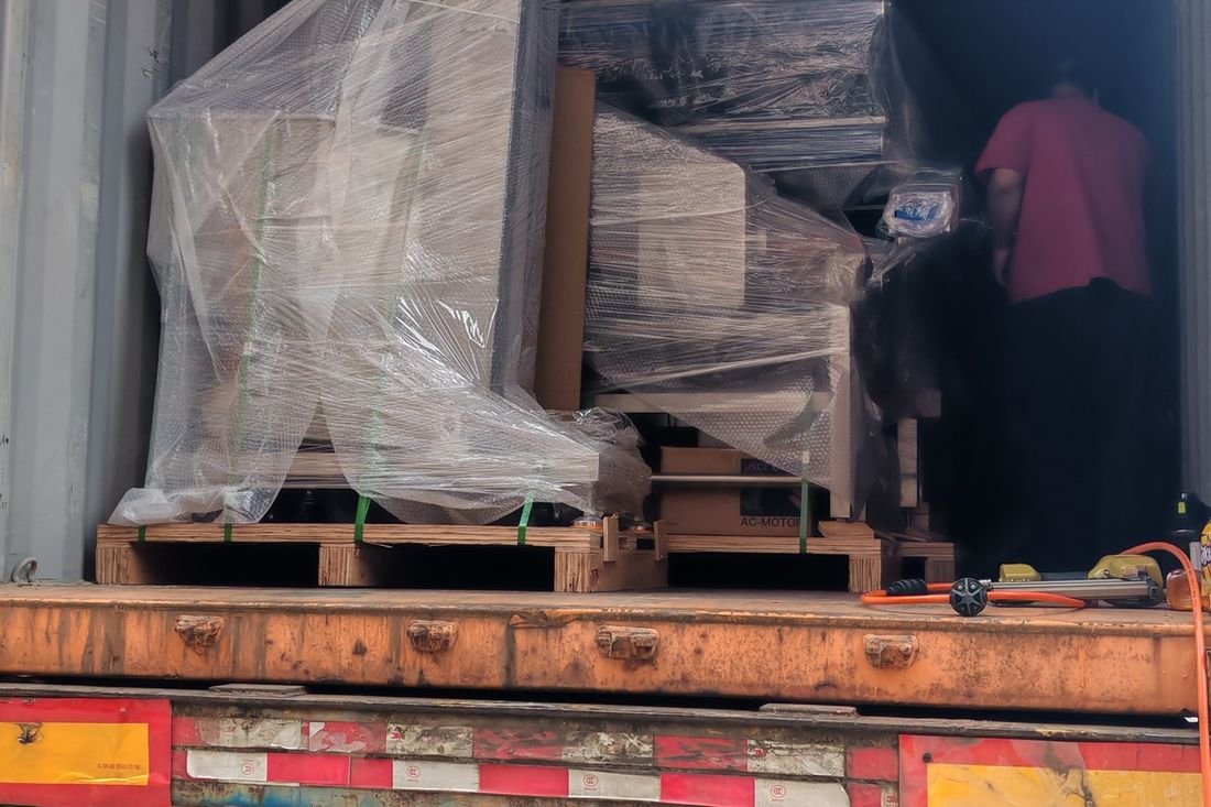 Oral-pouch line container-shipment photo