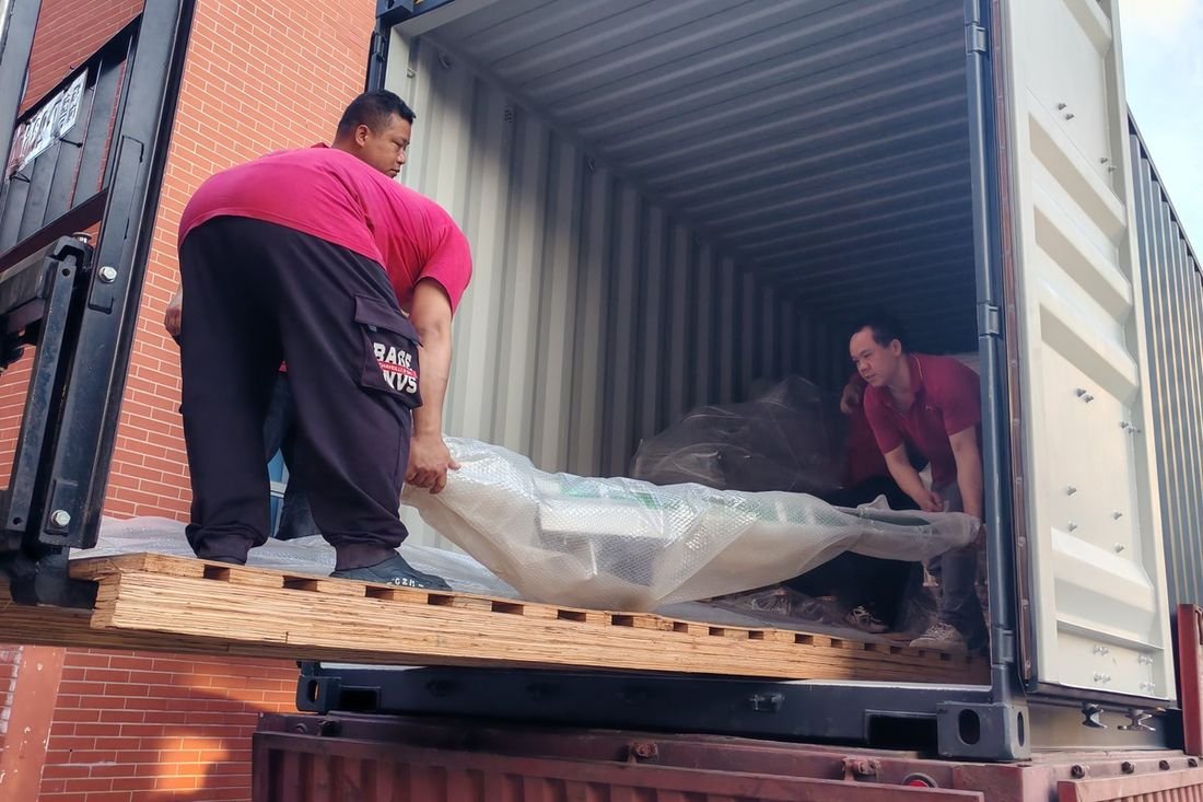 Oral-pouch line container-shipment photo