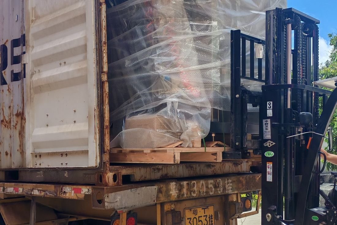Oral-pouch line container-shipment photo