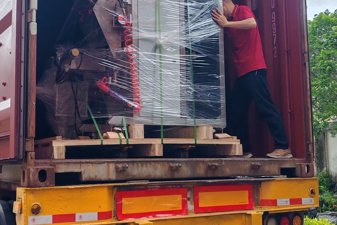 Oral-pouch line container-shipment photo
