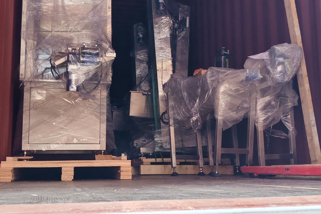 Oral-pouch line container-shipment photo