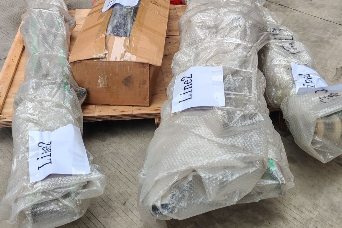 Oral-pouch line container-shipment photo