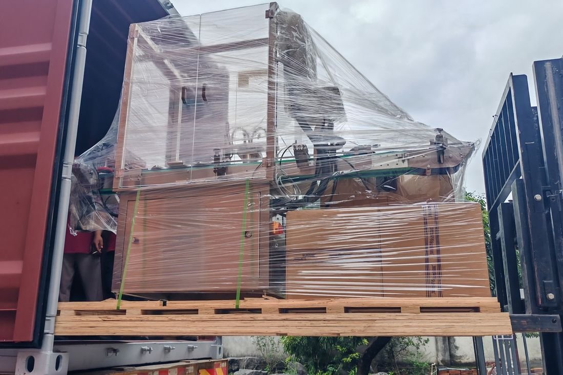 Oral-pouch line container-shipment photo