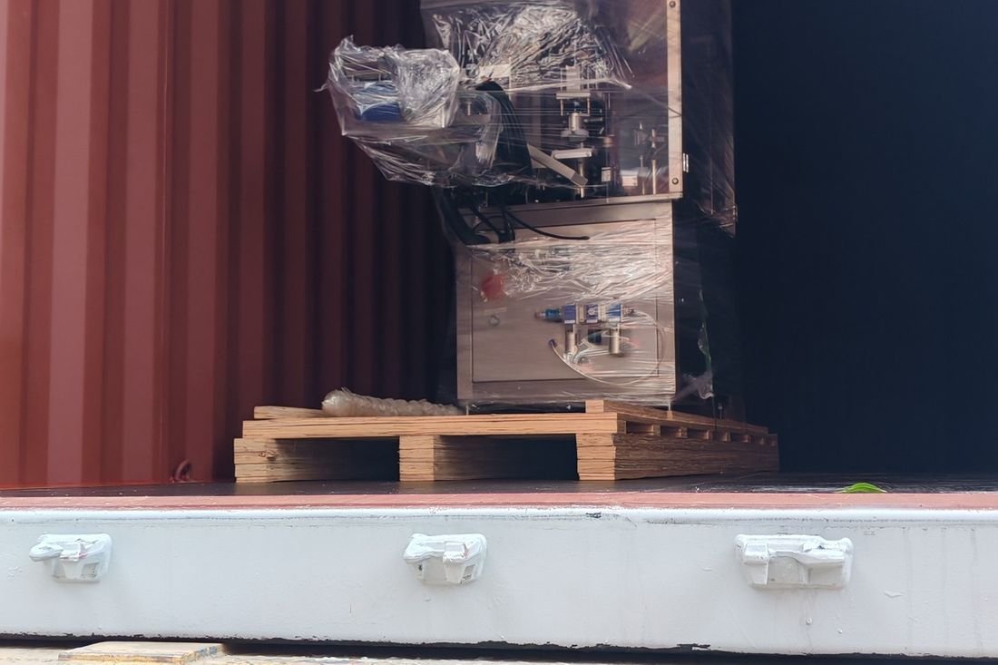 Oral-pouch line container-shipment photo