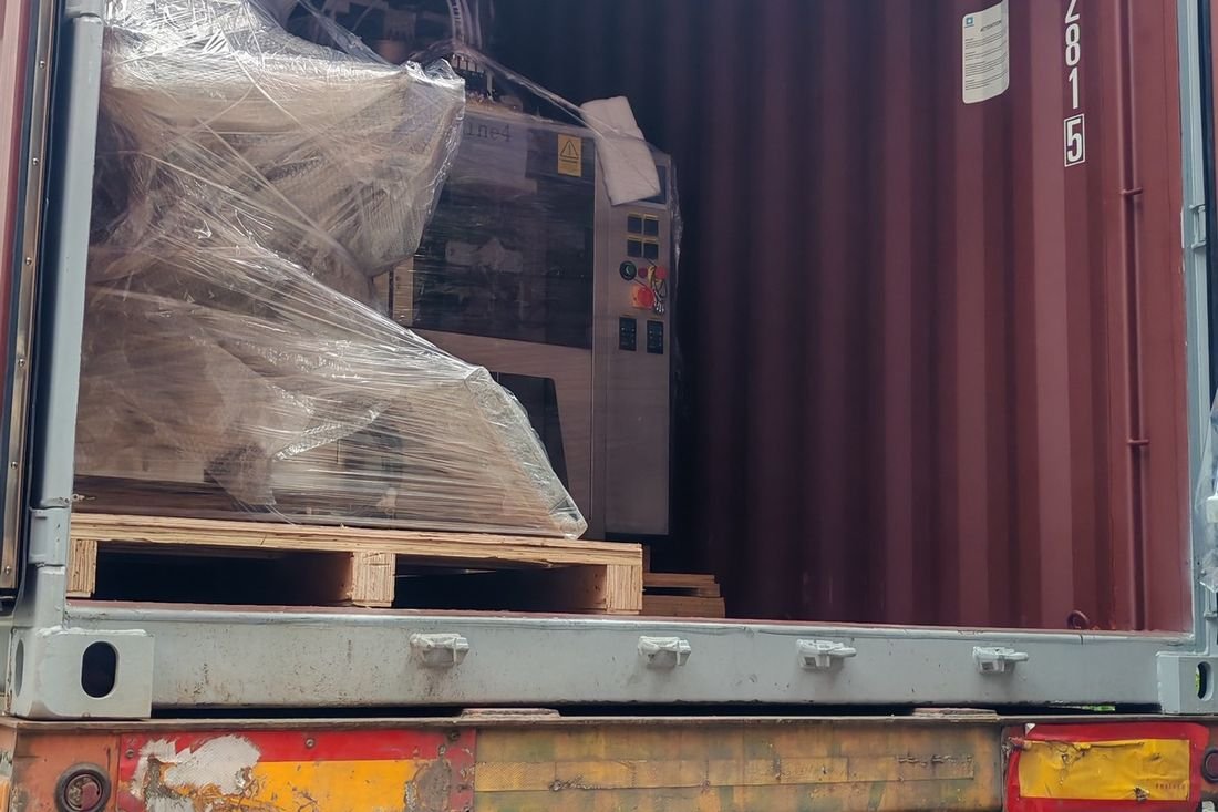 Oral-pouch line container-shipment photo