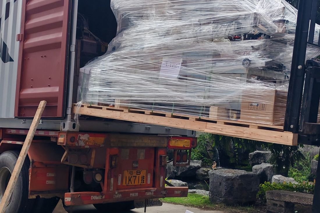 Oral-pouch line container-shipment photo