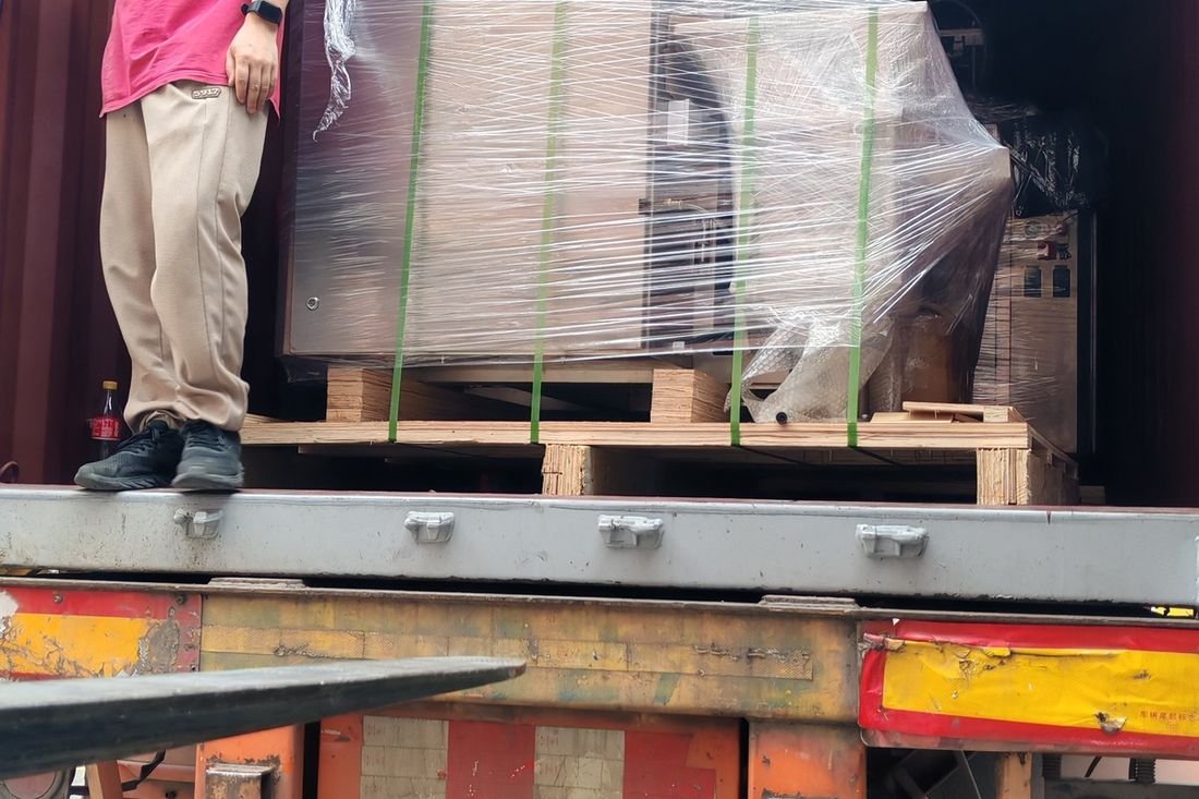 Oral-pouch line container-shipment photo