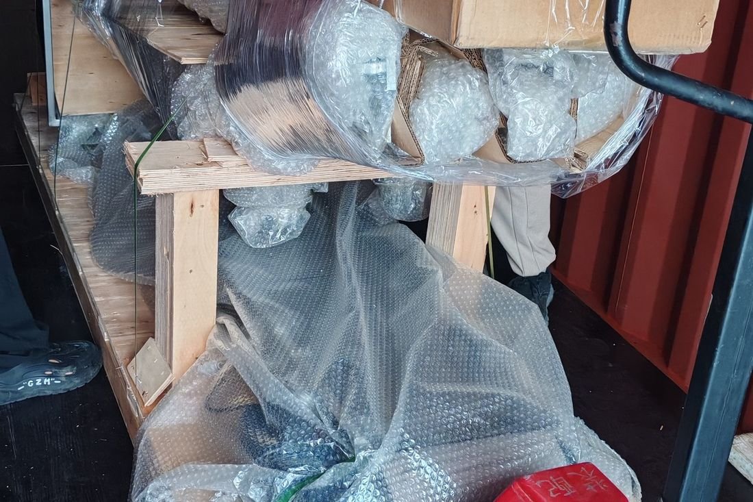 Oral-pouch line container-shipment photo