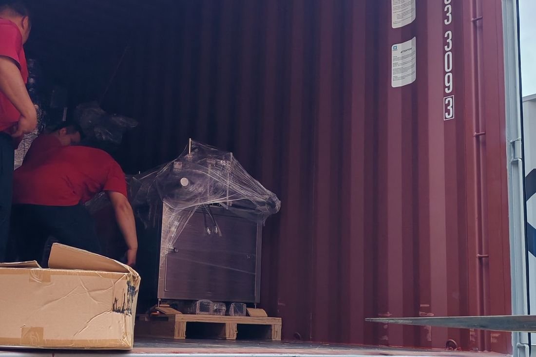 Oral-pouch line container-shipment photo