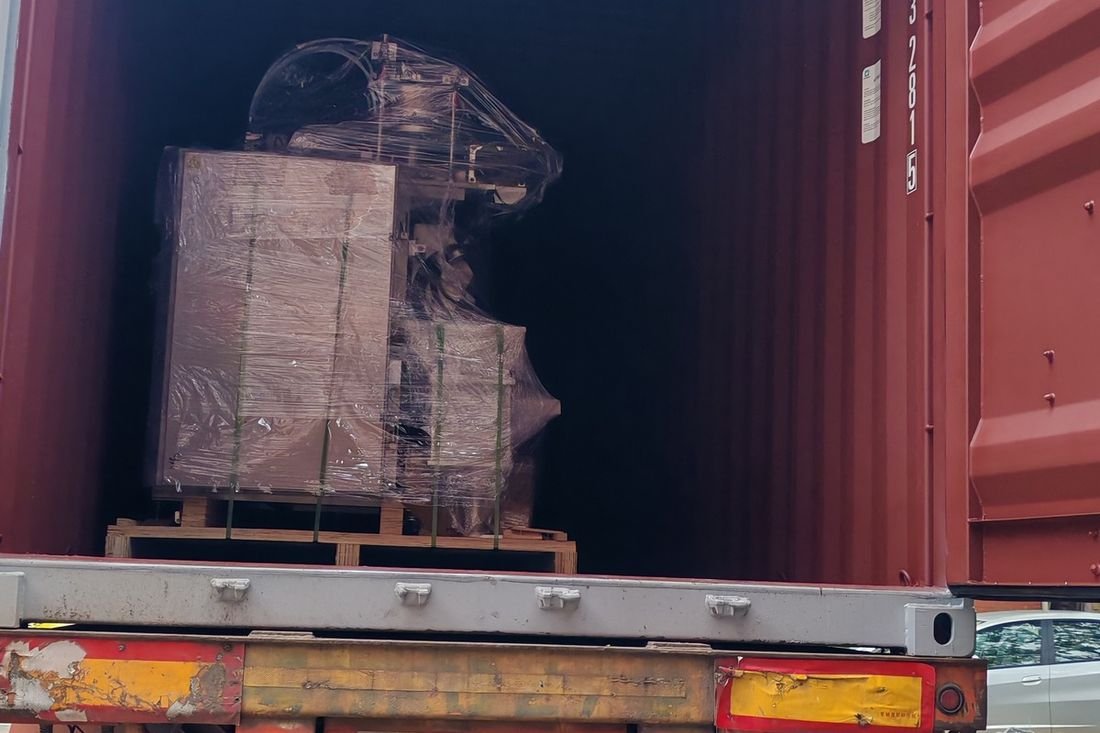 Oral-pouch line container-shipment photo