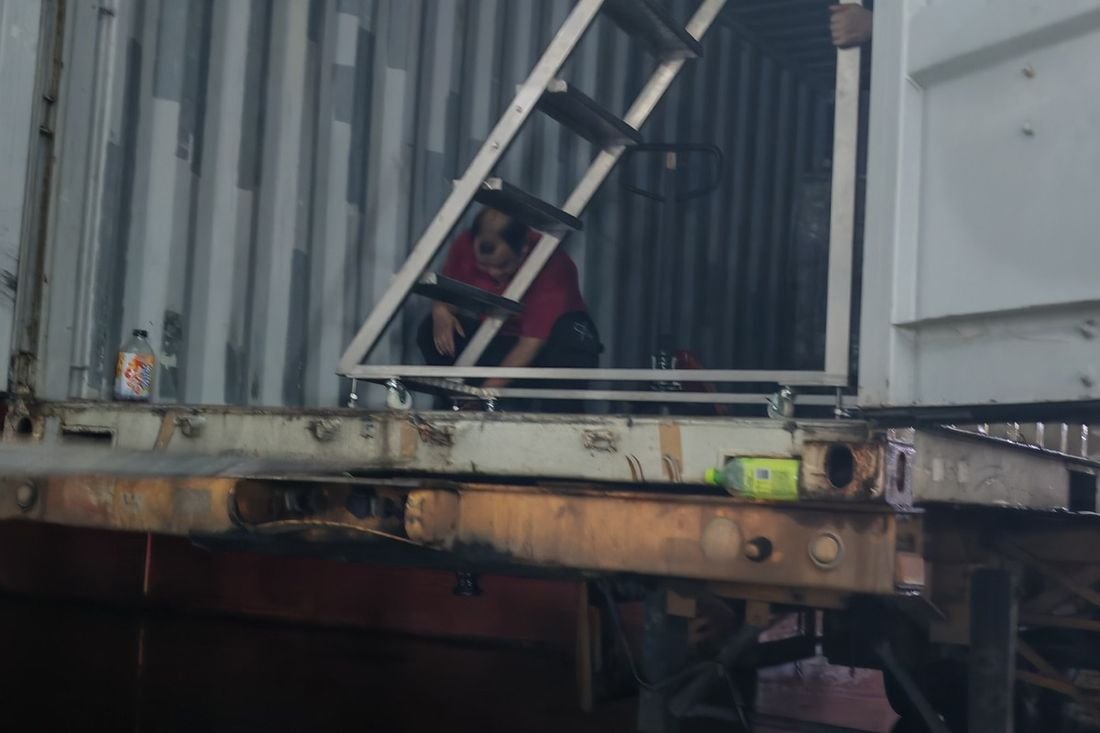 Oral-pouch line container-shipment photo